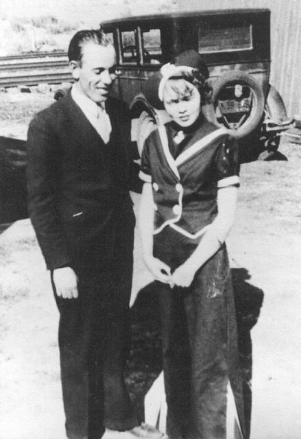 photo: Tom and Irene Ferrel, very young; standing infront of a Model T.